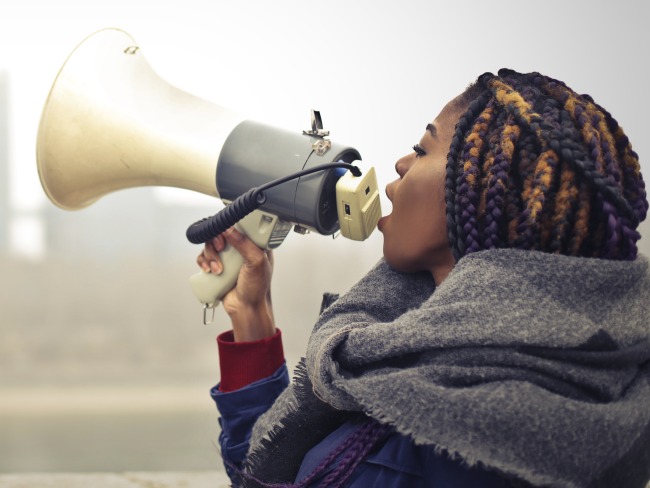 Woman speaking into megaphone